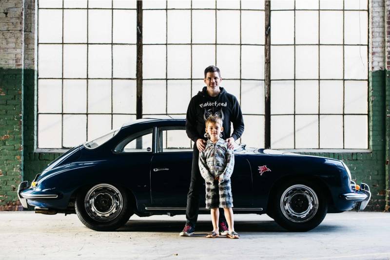 Woodside client in front of porsche 911