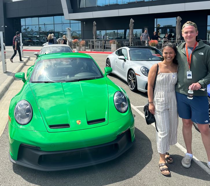 Xyrine Dapal Woodside Credit next to green porsche 911