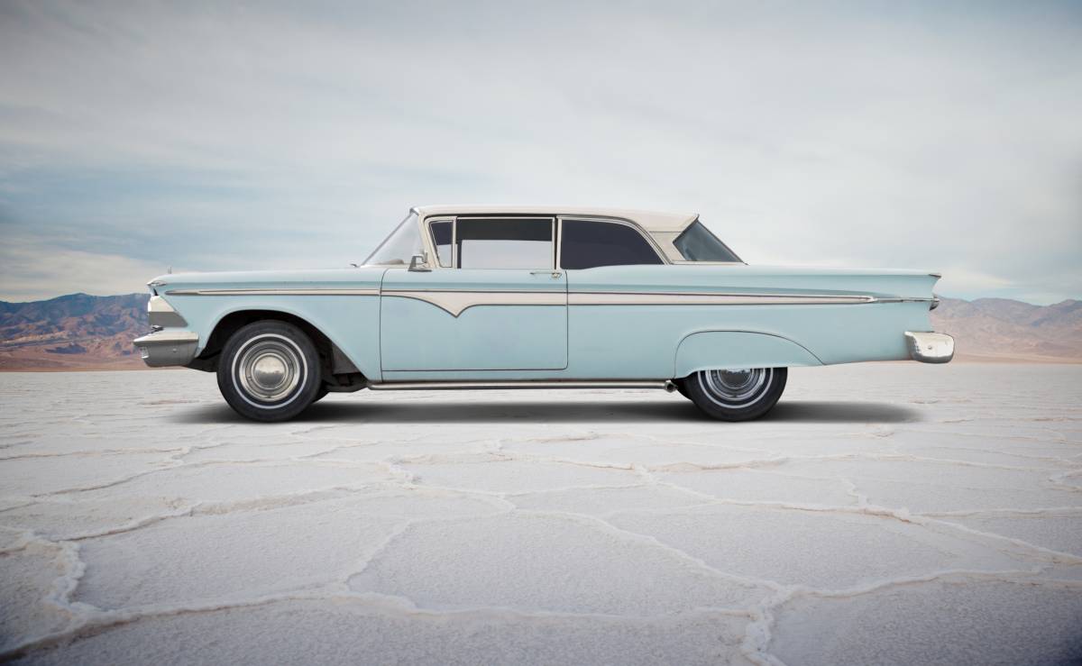 blue classic car on salt flats