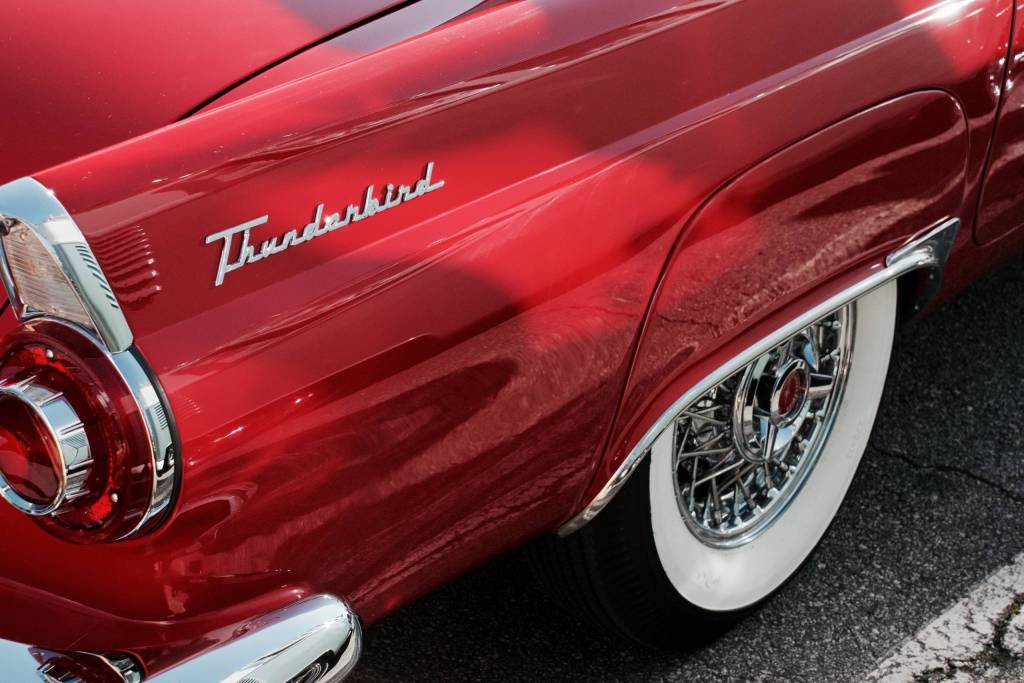 rear quarter panel of a red Ford thunderbird